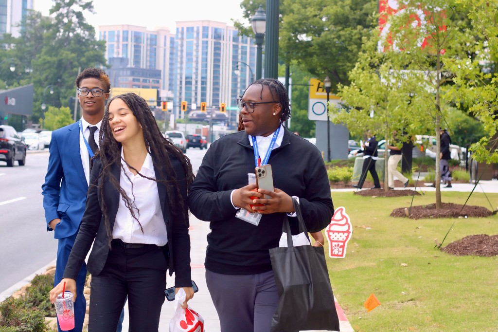Student leaders walking together during a Foundation event