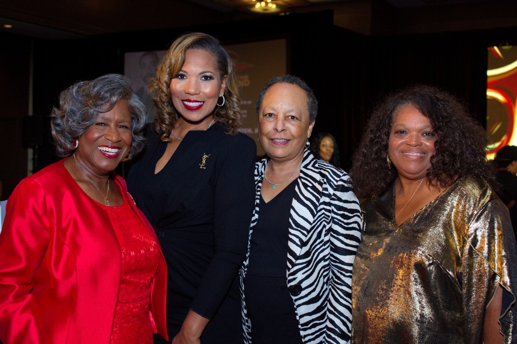 Four guests posing together at Hall of Fame Weekend