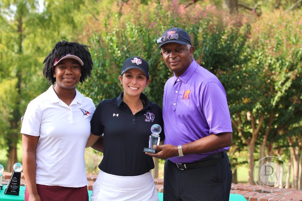 HBCU golfers and a coach celebrating with a trophy